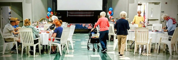 Senior reflecting on Memorial Day honoring fallen soldiers in an independent living community